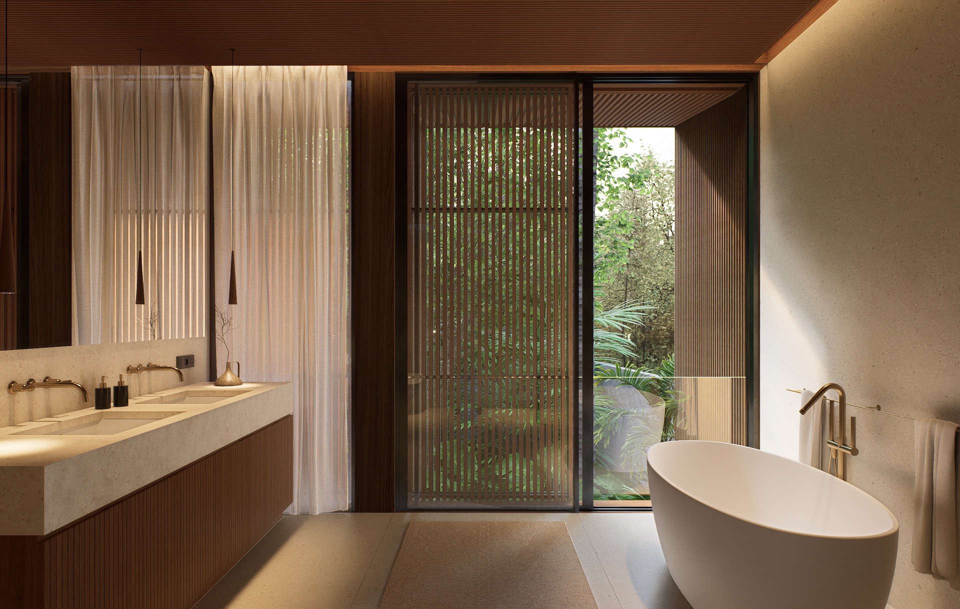 View of master bathroom with double sink configuration and free standing bathtub at tatma residence