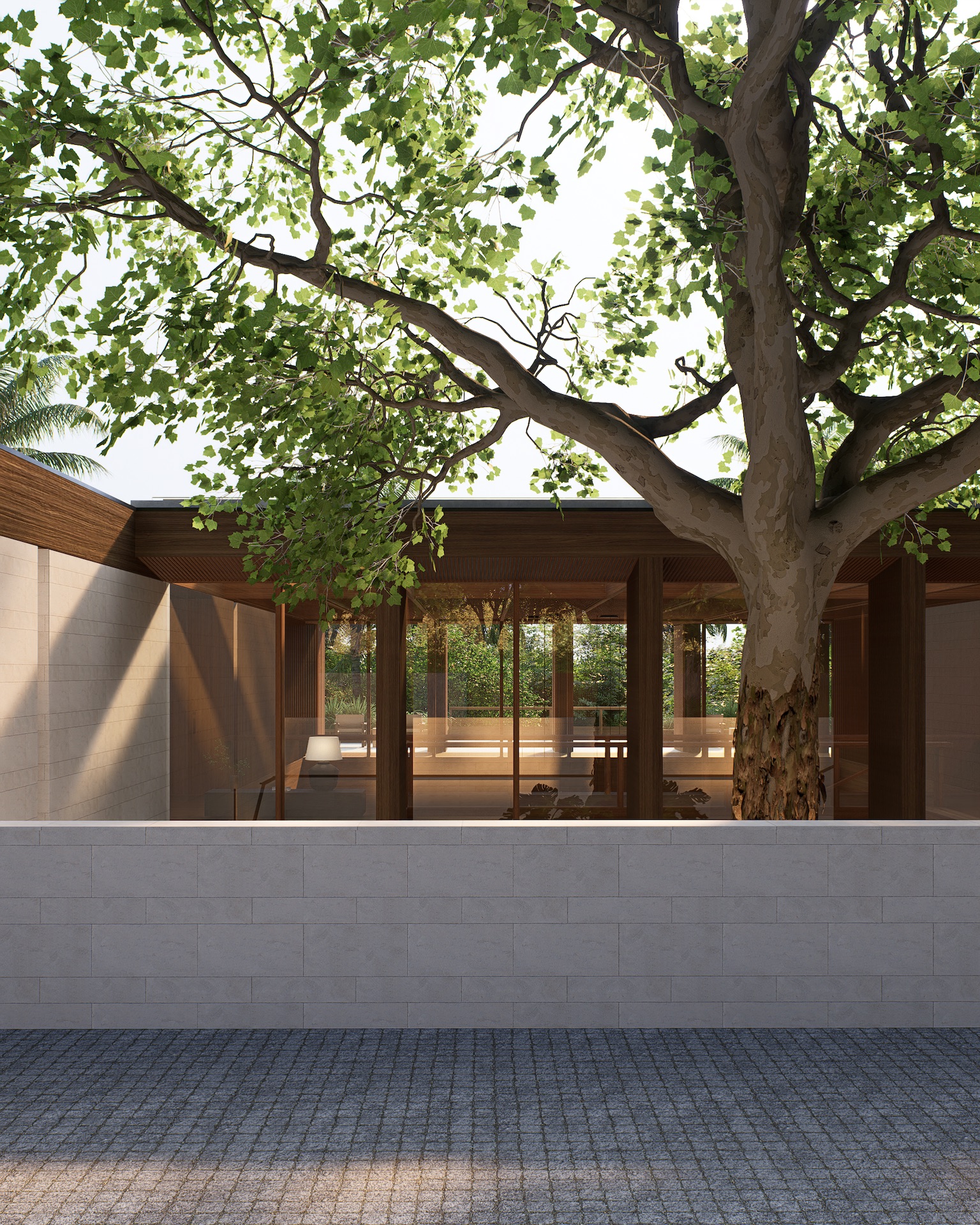 arrival to the house with cobbled stone driveway and sand stone wall claddings