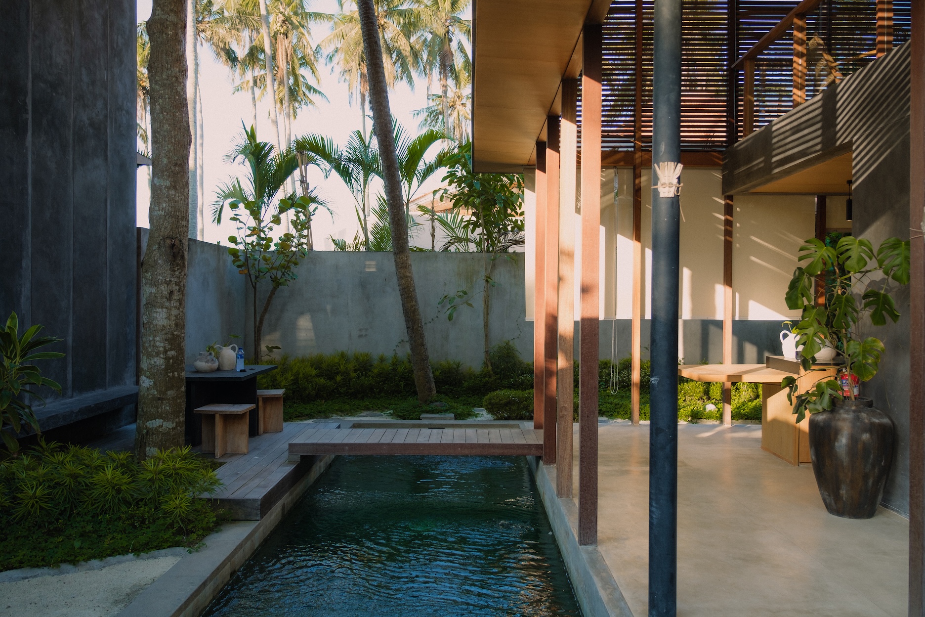 Landscape view of 2nd villa swimming pool showing bridge towards dining area