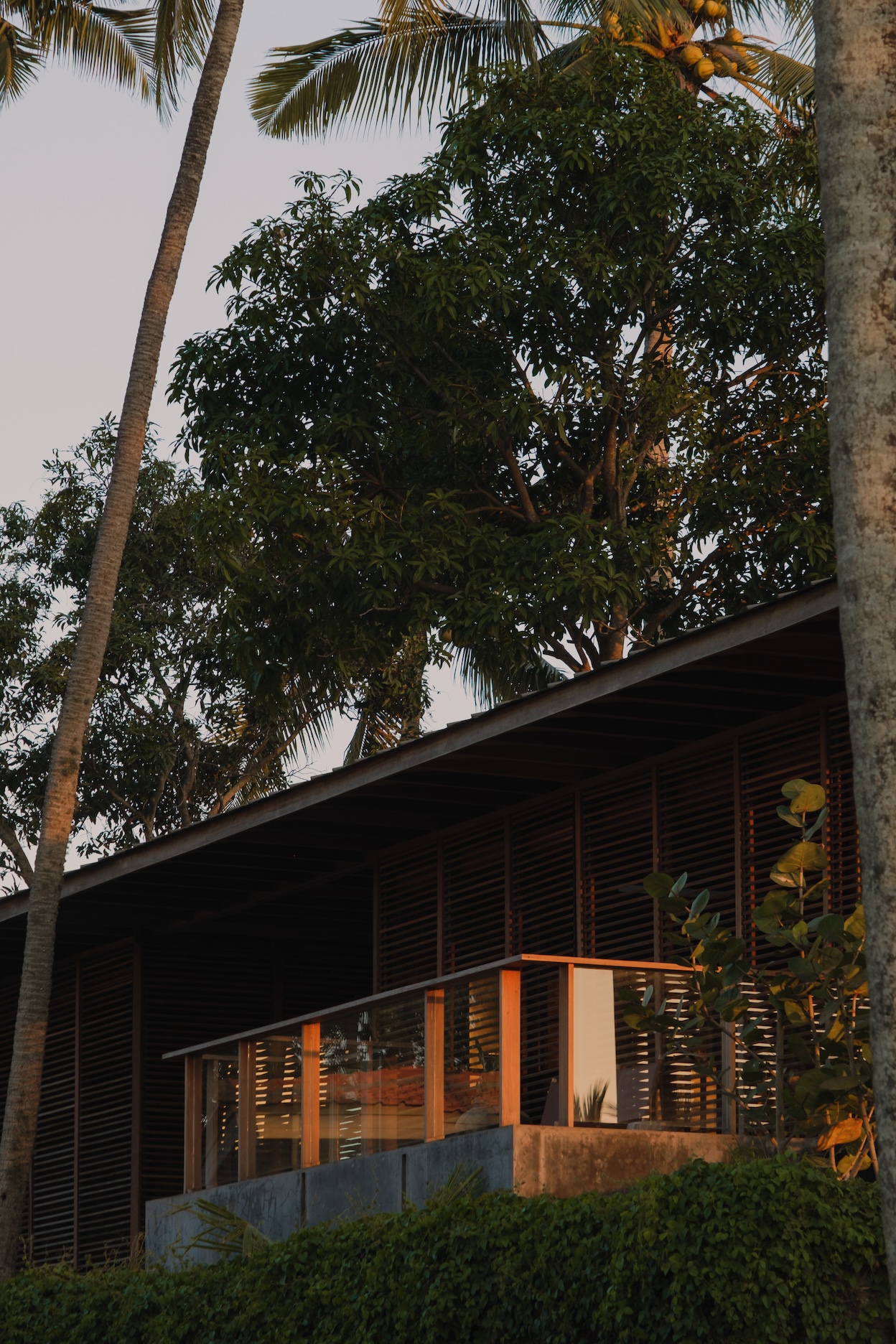 Close up view of the extruding balcony of the 1st villa surrounded by wooden handrails