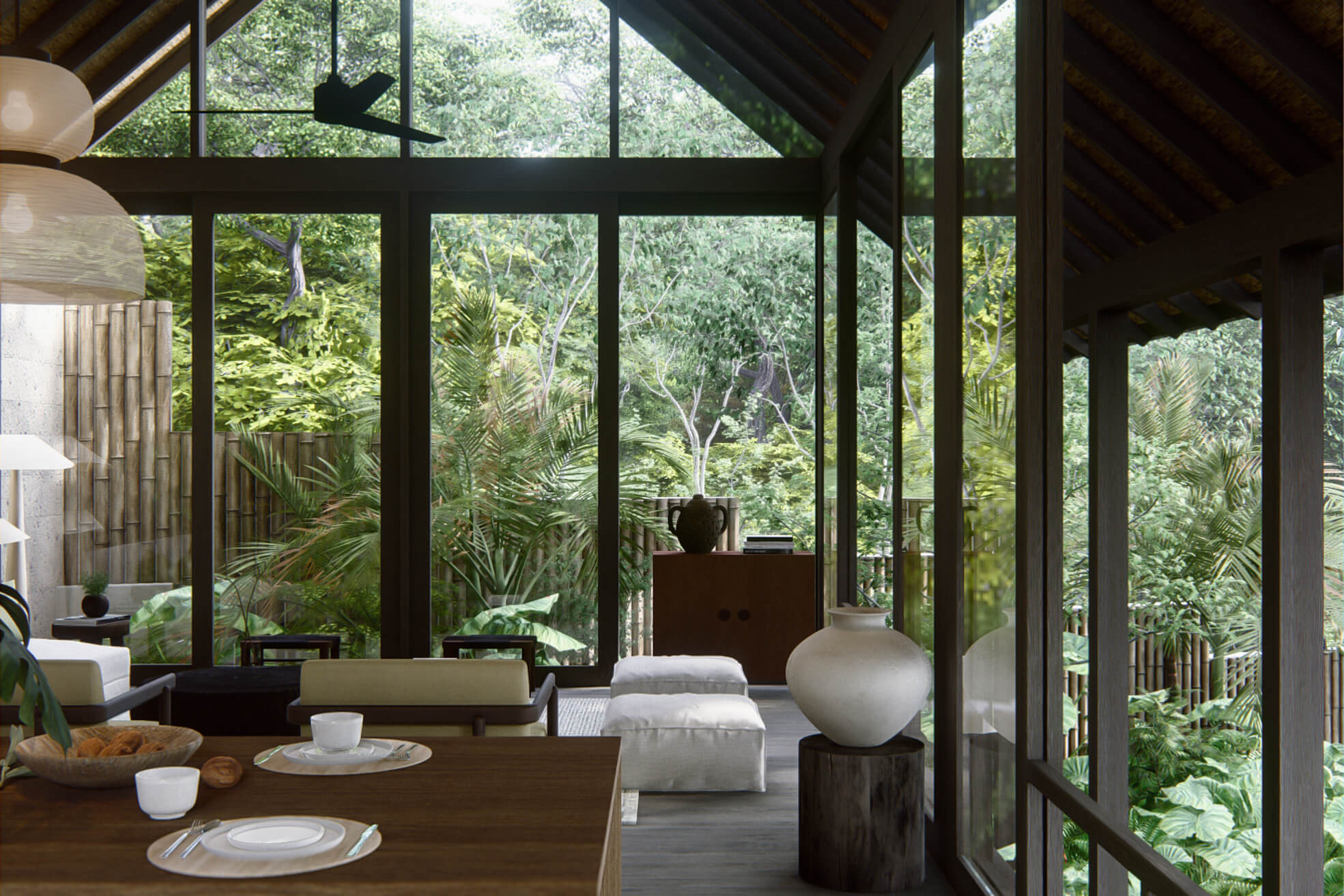 Living room view at the main building showing arm chairs and poufs together with large wooden window opening