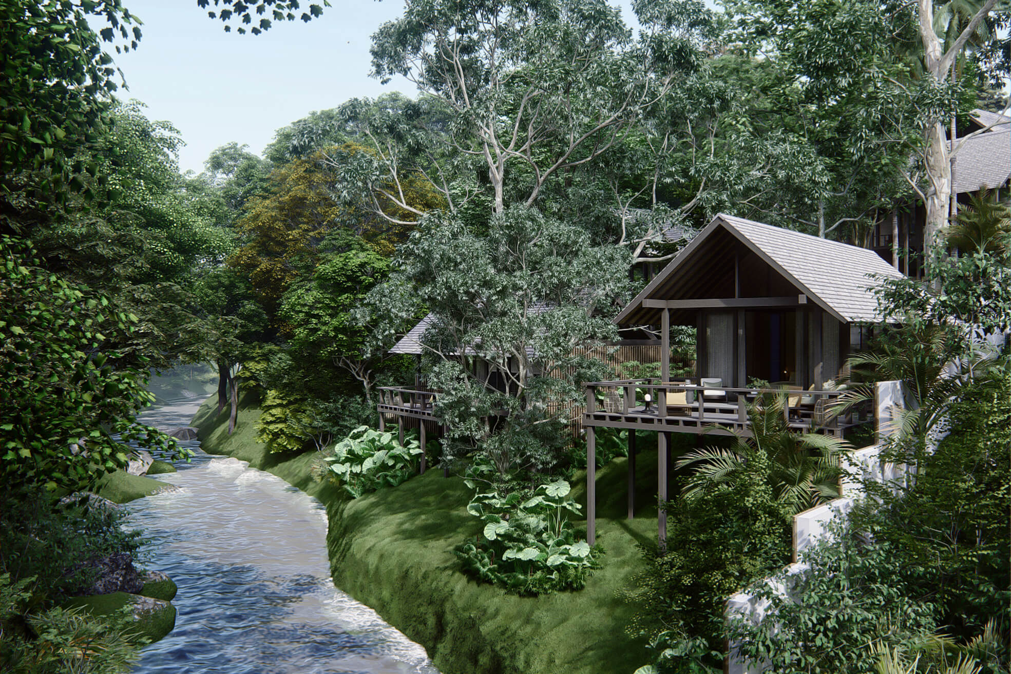 Side view of rumah lituhayu looking down the river stream showing villa 3 and 4 at the edge of the river