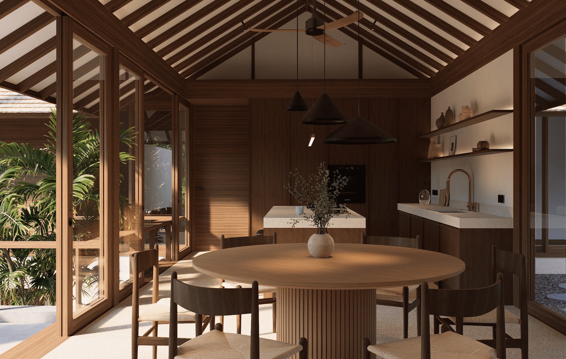 View of the dining room and kitchen space at rumah umadawa with built in appliances and free standing kitchen island