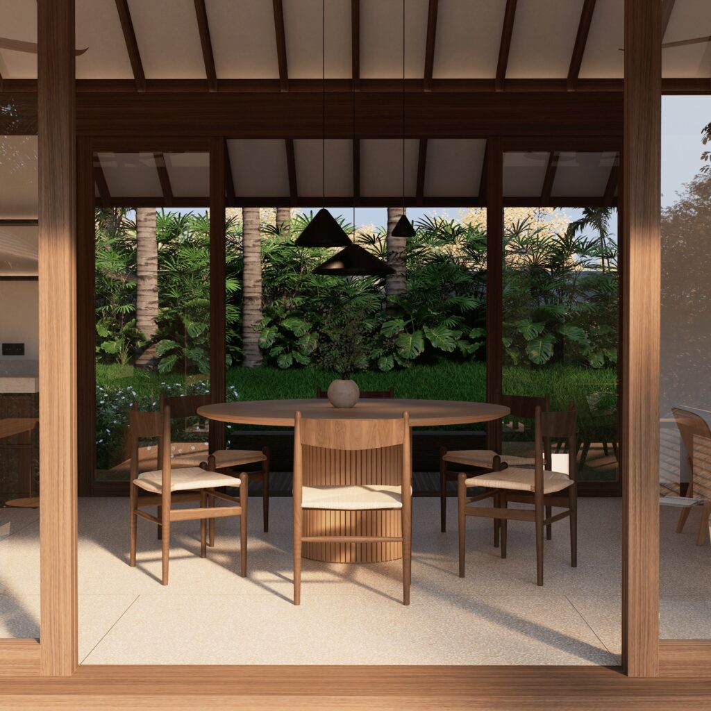 Dining room of the house showing round table and pendant lamps with exposed wooden roof structure