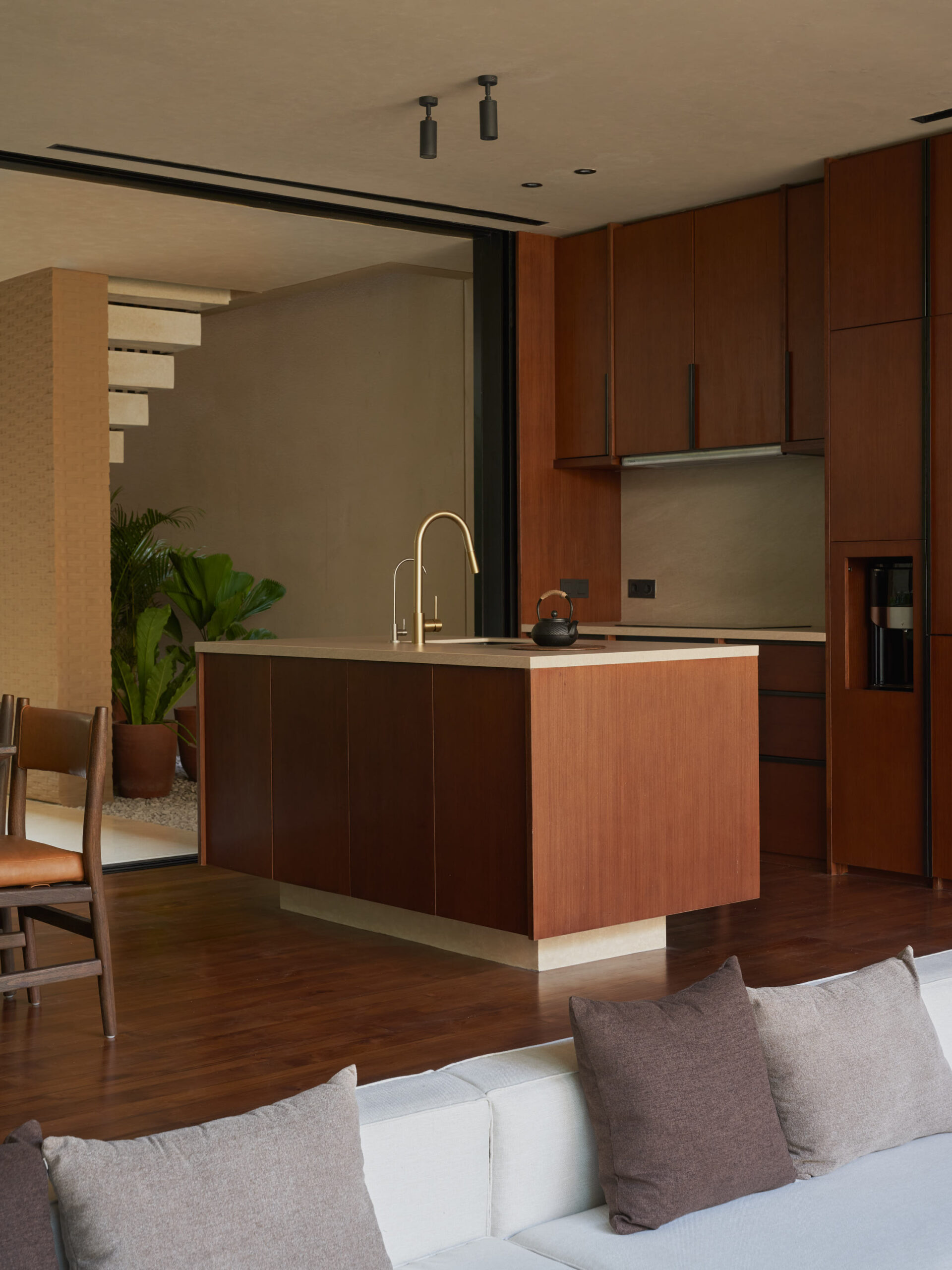 View of the kitchen island  and the background staircase