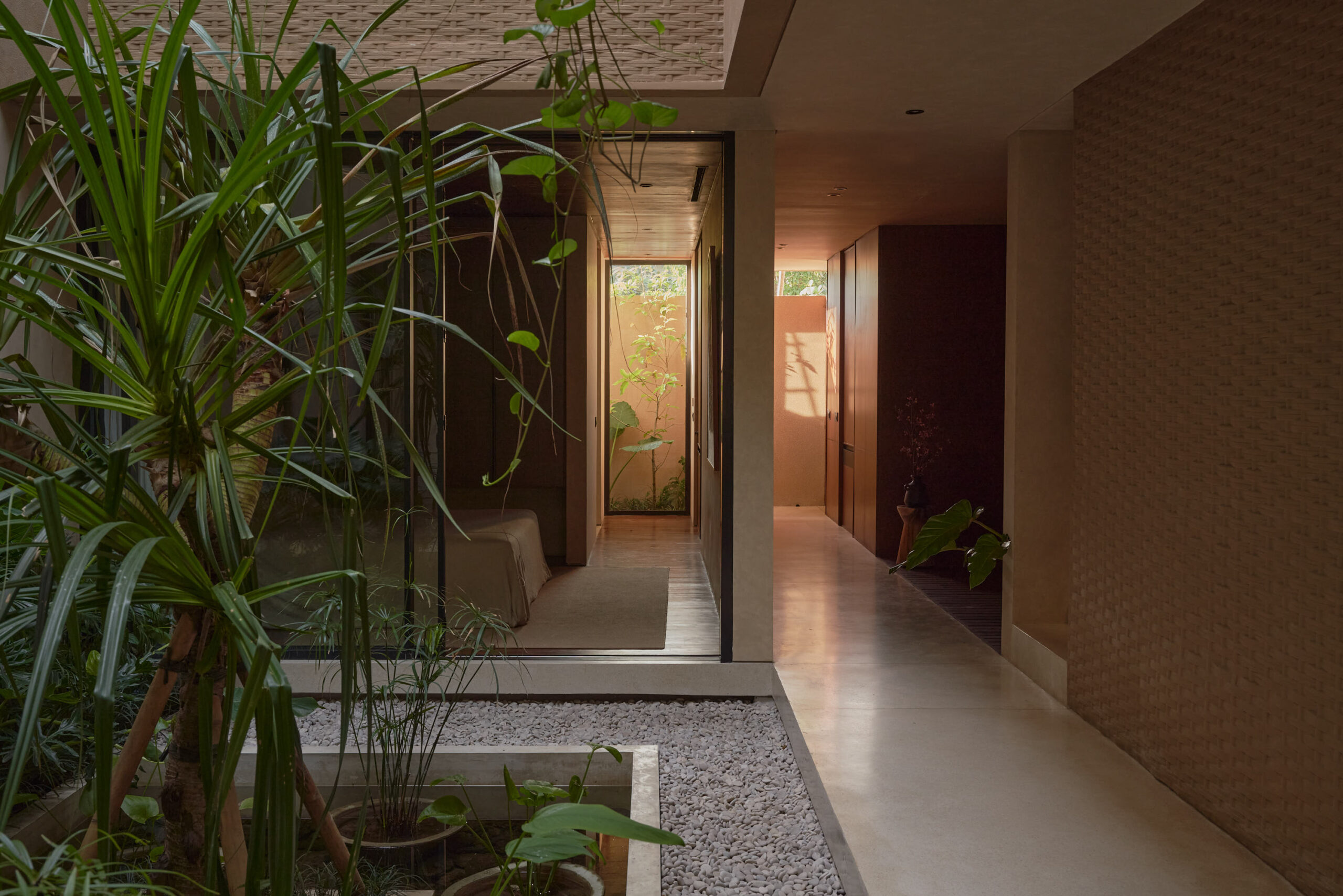 Horizontal view of the inner courtyard looking towards the entrance corridor through the ground floor bedroom