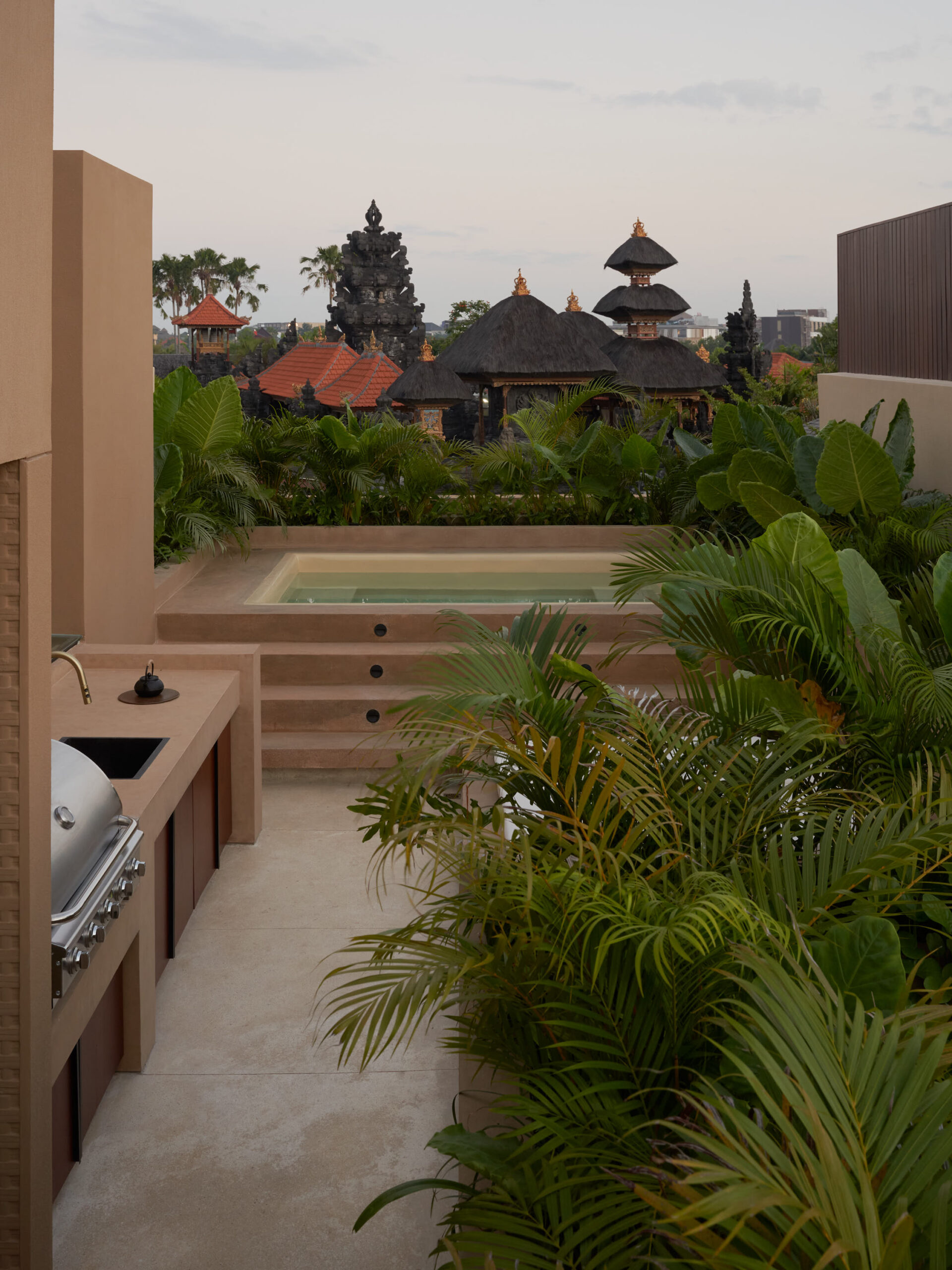 View of the roof top looking towards the plunge pool overlooking a Balinese temple