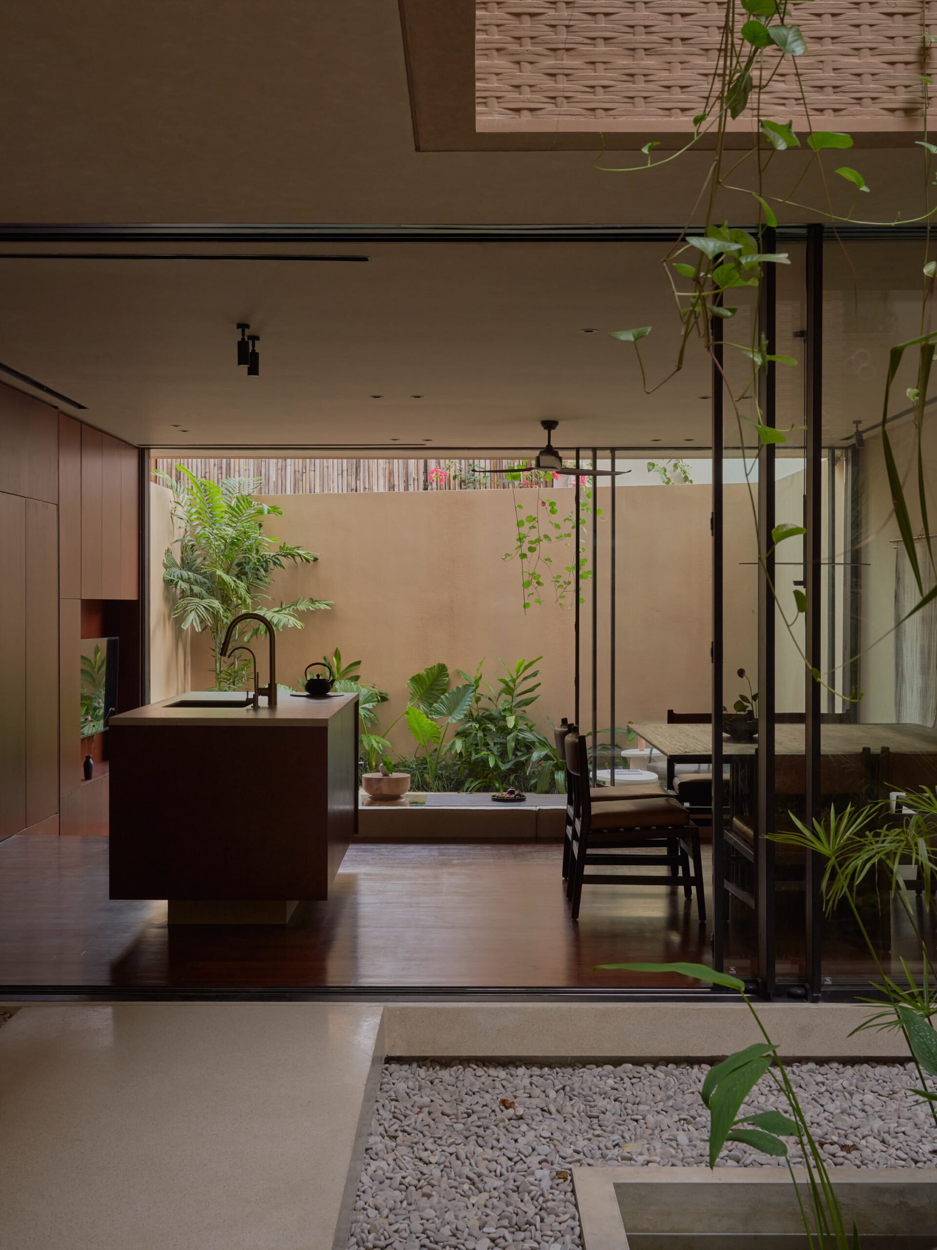 View showing the connection between the inner courtyard connected with the main living space and the back garden