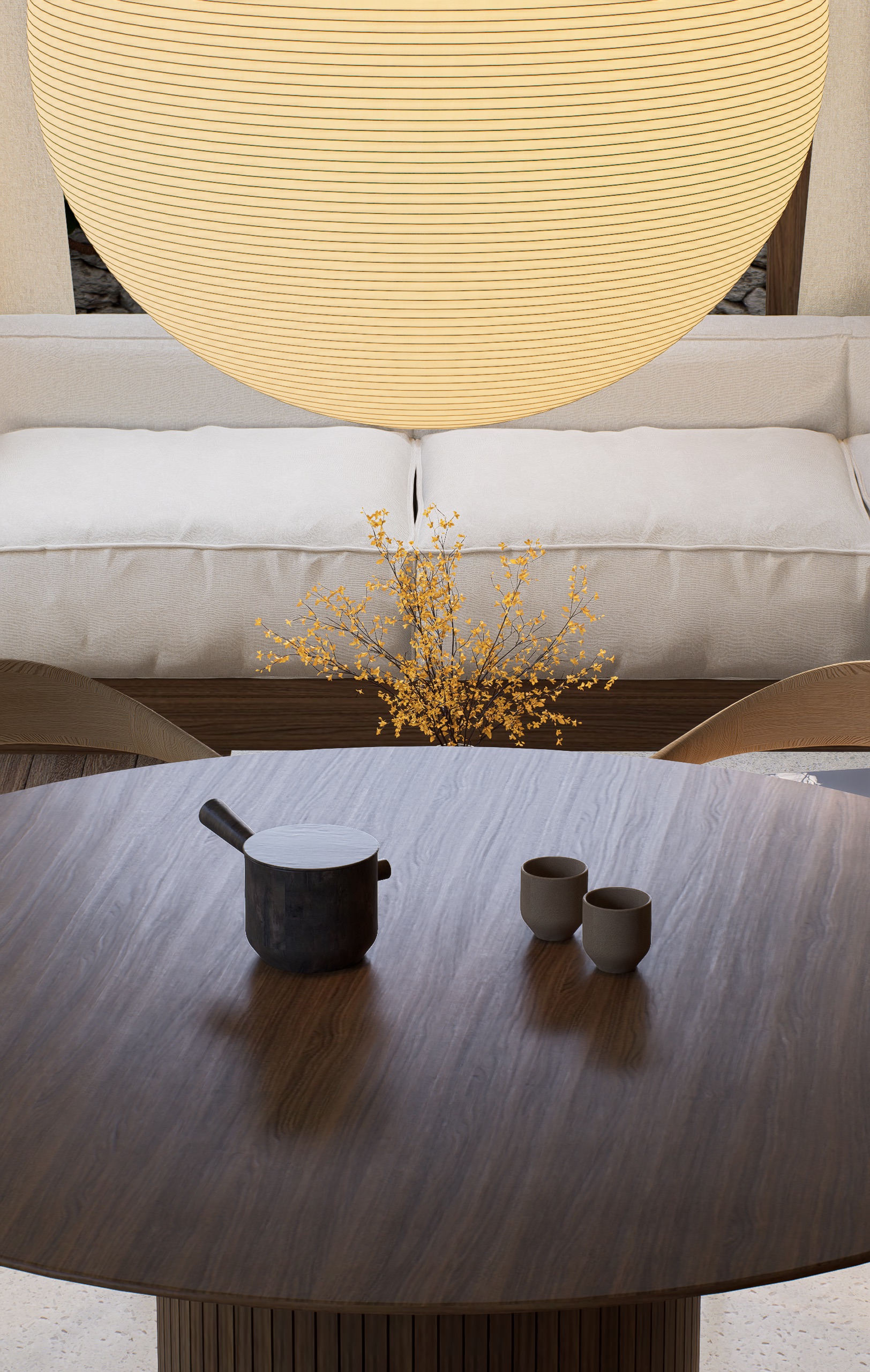 Detailed view of dining table, pendant lamp and sofa in the background
